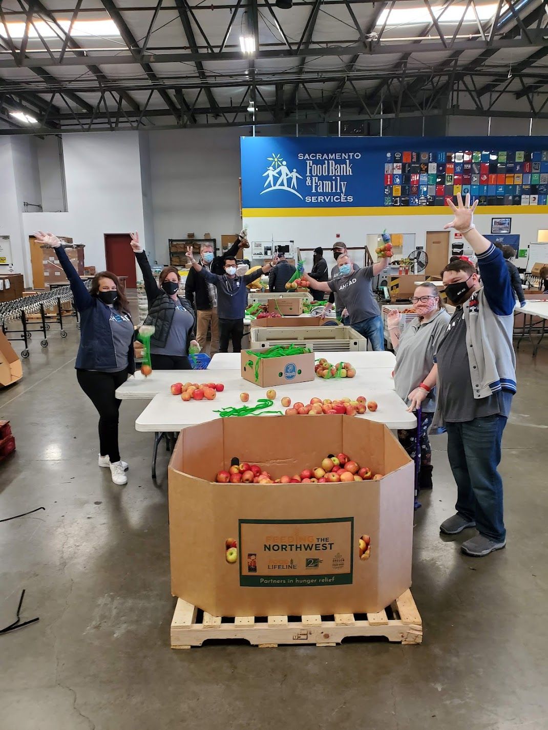 employees volunteering at a food bank